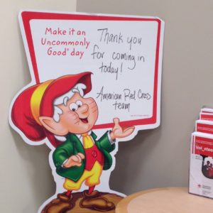 Ernie the Keebler elf holding thank you sign