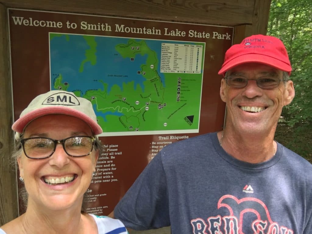 Kathy and George in front of Smith Mountain Lake State Park sign 