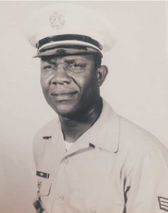 a black and white photo of Antoinette's father in his military uniform 