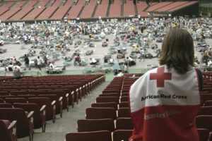 Red Cross Hurricane katrina worst hurricanes worker looking over astrodome