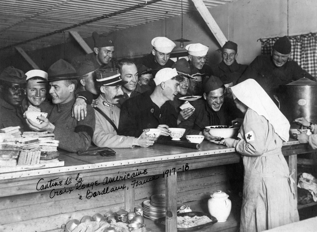 American and French Servicemen enjoy themselves at an American Red Cross canteen in Bordeaux, France, 1917-1918. 