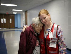 June 2008. Devastating floods covered parts of Indiana affecting residential areas, farmlands, and businesses. Nurse Melissa Schultz, a Red Cross volunteer, comforts Doloris Faust, who is staying at a Red Cross shelter in Martinsville, Indiana. 