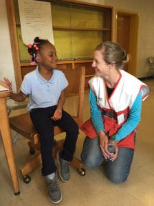 Red Cross volunteer annemarie Gallagher talks with Najada,6, who is staying with her family at the shelter in Goldsboro, North carolina
