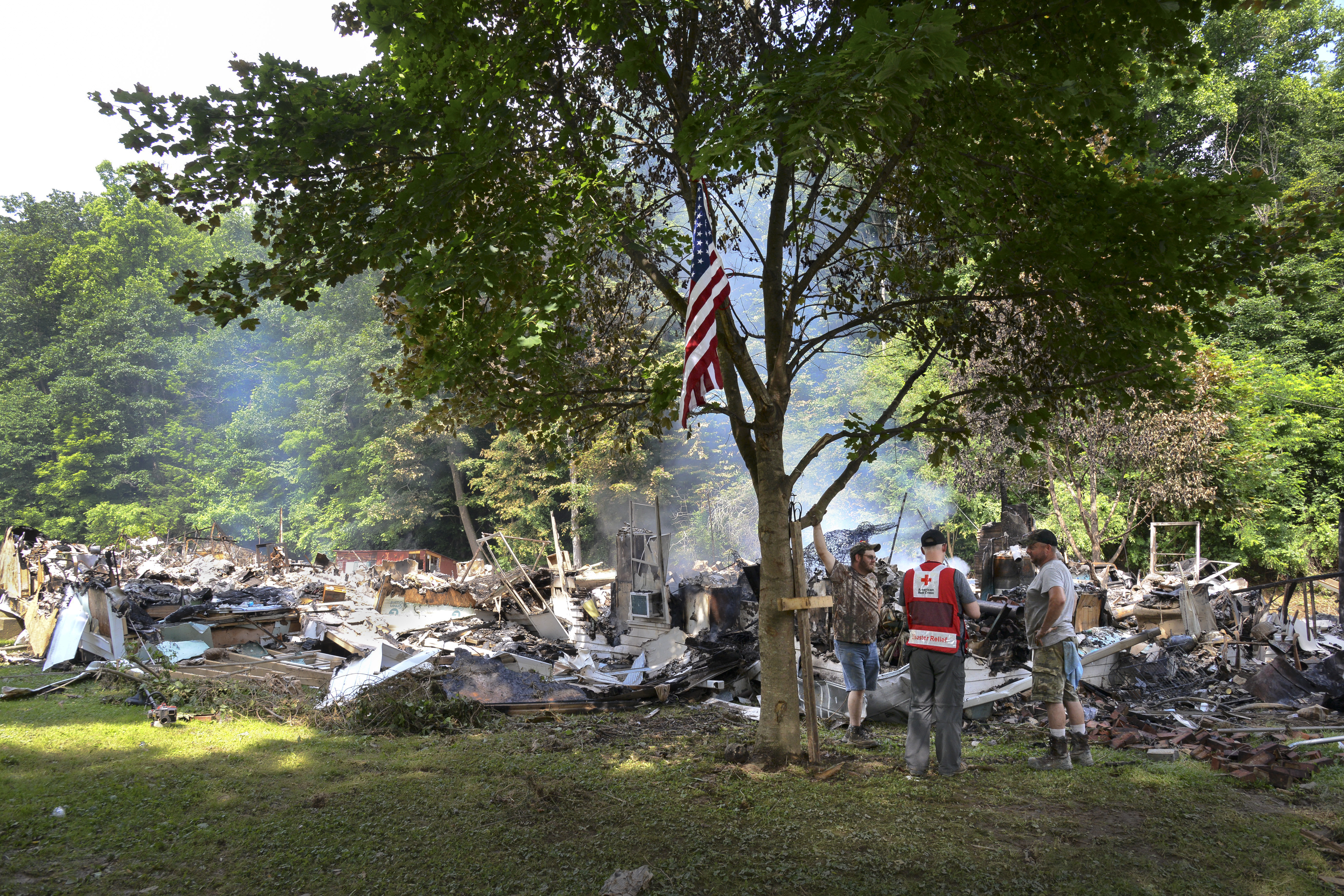 A Red Cross worker a family whose house was flooded and then caught fire in the West Virginia floods.