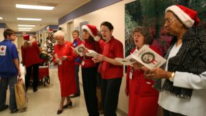 Red Cross volunteers at Walter Reed singing carols
