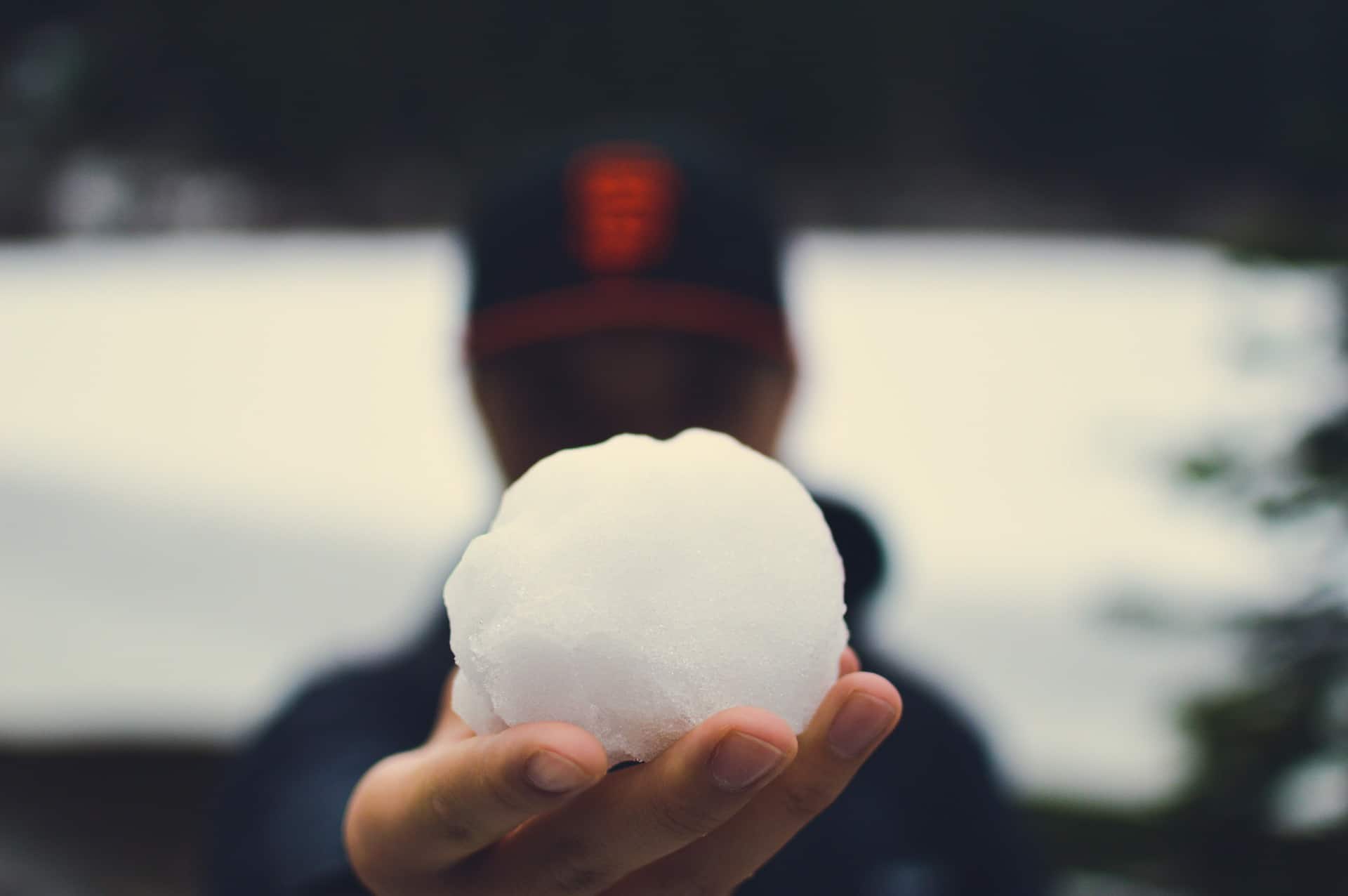 man holding snowball