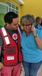 Puerto Rico resident talks to a loved one on the phone