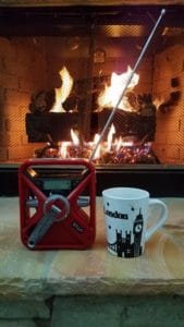 Hand crank radio in front of fireplace