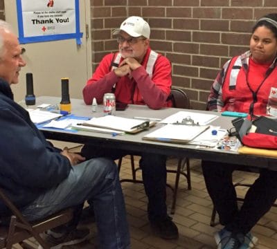George Stanley Checks in with Red Cross Volunteers at the Branford Shelter