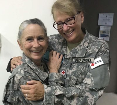 Phyllis hugging her friend and volunteer, Cheryl Searcy.