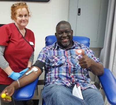 Lucy and TJ smiling during TJ's blood donation.