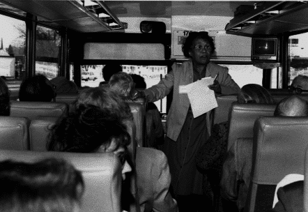 Gwen Jackson Standing on Volunteer Bus