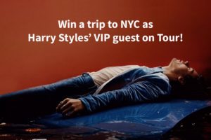 Harry Styles laying on his back. "Win a trip to NYC as Harry Sty'es' VIP Guest on Tour."