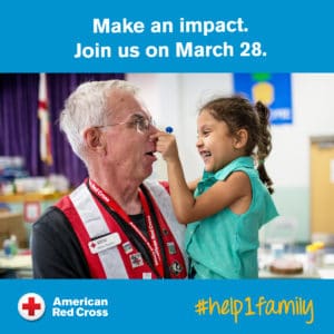 Red Cross Volunteer holds a little girl in his arms. "Make an impact. Join us on March 28."