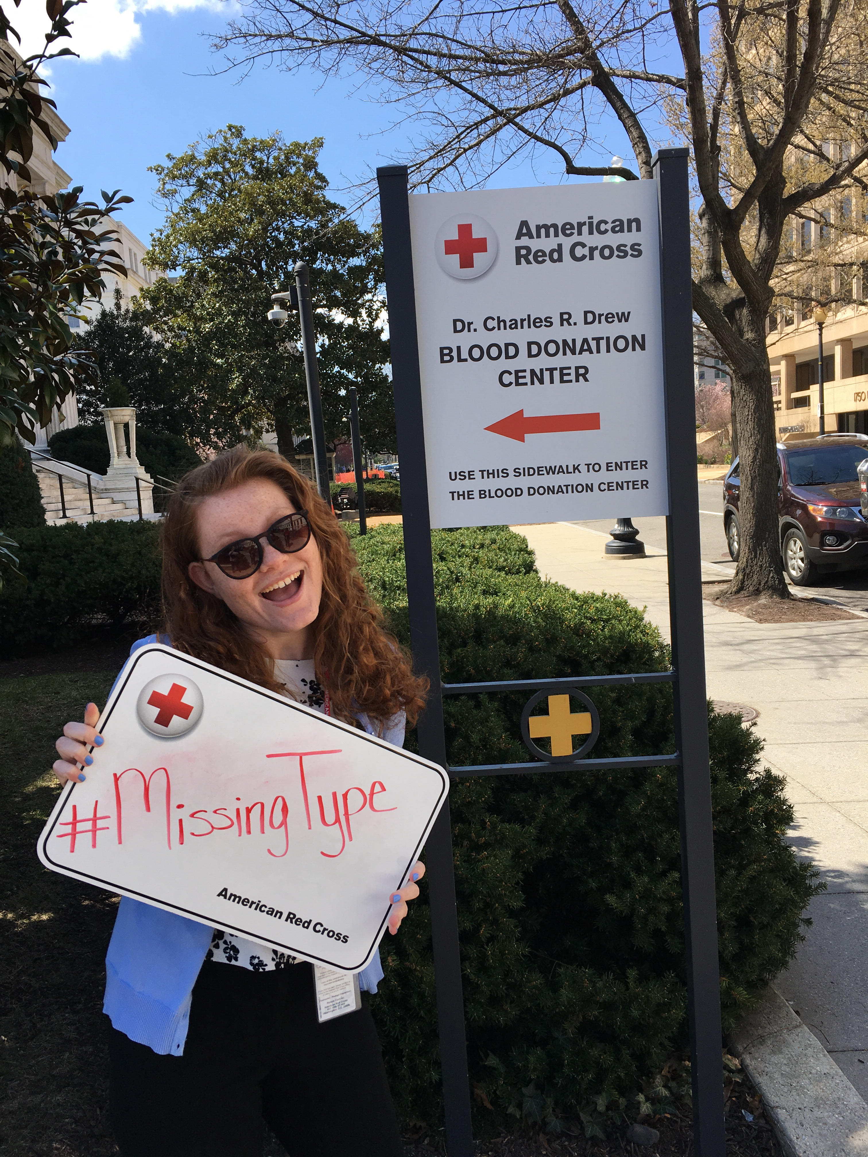 Katie holding a board that says "#MissingType."