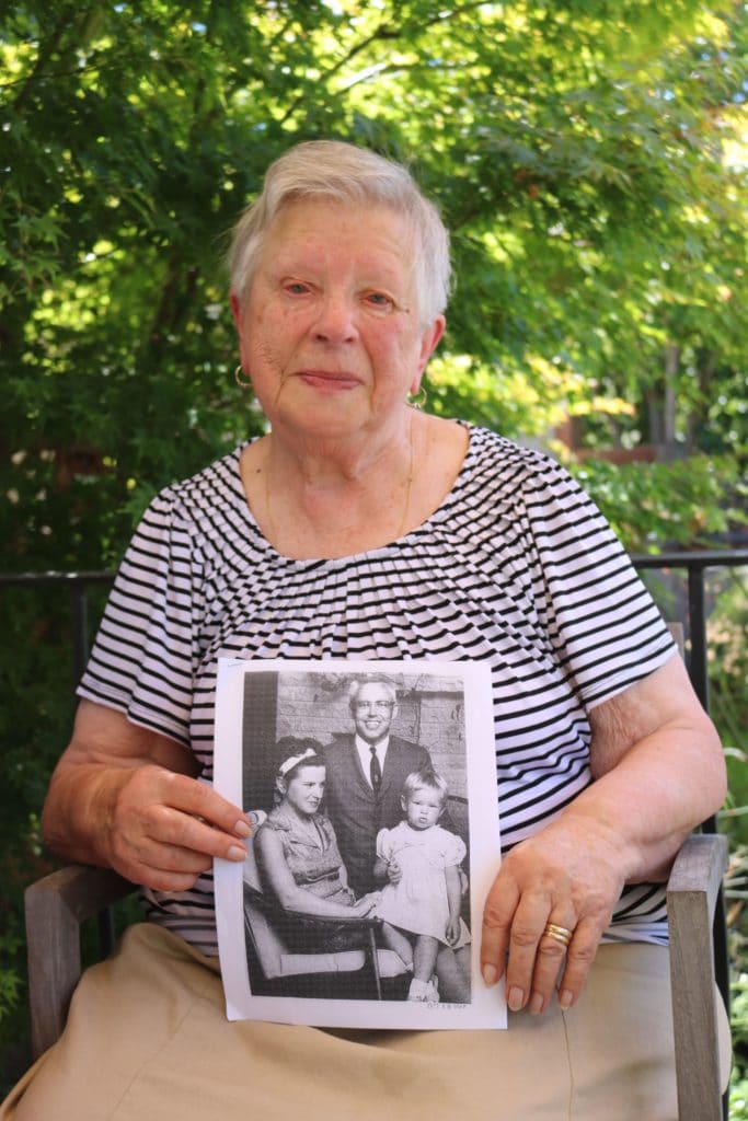 Tamara is holding a cherished photo of herself, her late husband Oleg, and their daughter, Natalie. 