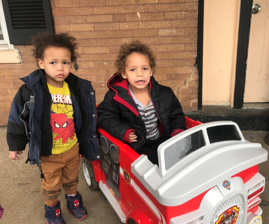 Kaliq and K’juan with K’juan’s new fire truck. After the Dec. 10th fire, K’juan asked for a fire truck for Christmas.
