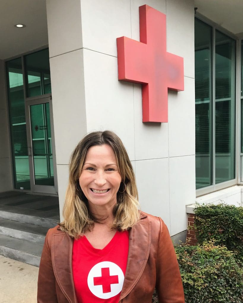Ashley Henyan standing in from of the Georgia Red Cross Chapter. 