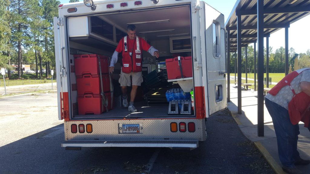 Joe loading supplies into his emergency response vehicle.