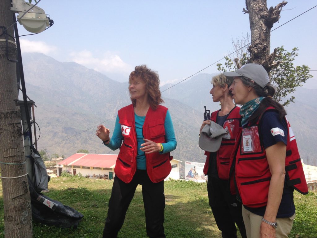 Julie speaking with other Red Cross volunteers during a disaster operation in Nepal.