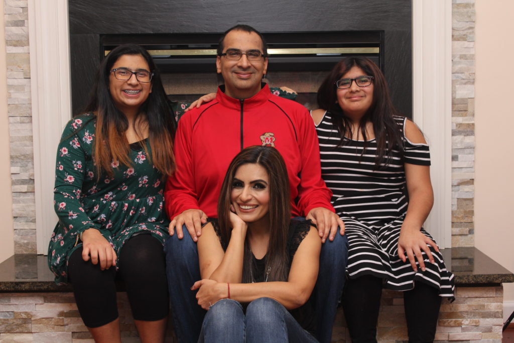 A family photo of Vikas, his wife and two daughters. 