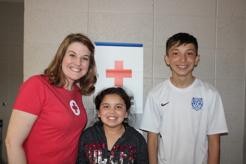 April Oppliger with Lily and JJ Lemus at the Red Cross shelter after the Nebraska floods. 
