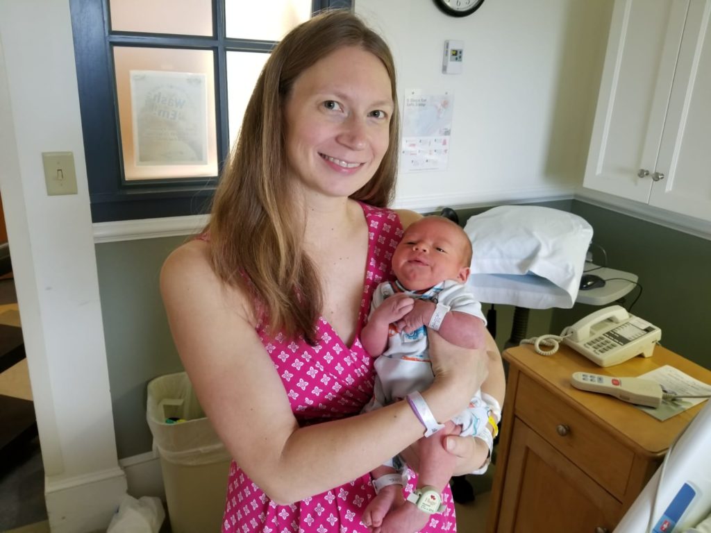 Joanna holding her baby boy. 