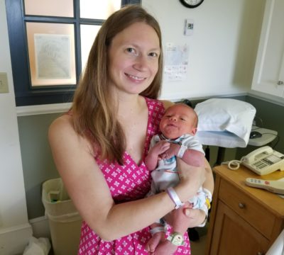 Joanna holding her baby boy.