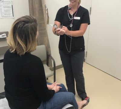 Sydney providing care to a patient.