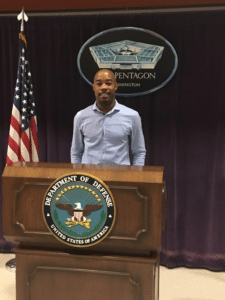 Eric standing in front of a podium.