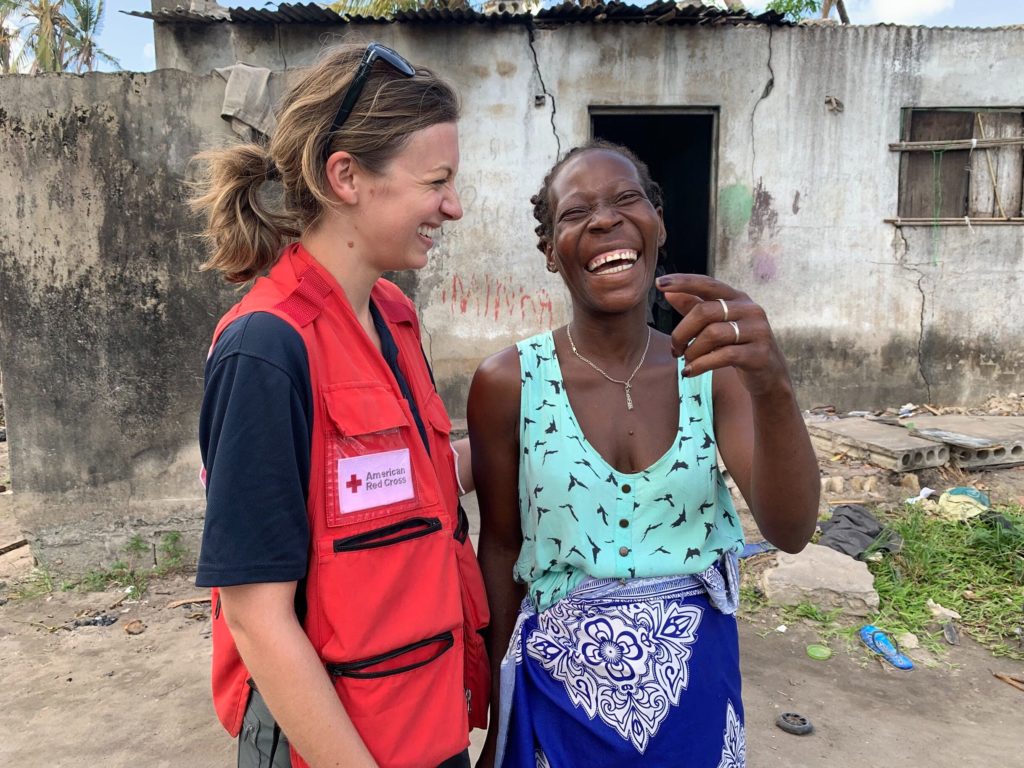 Katie and Gina Tomas Duarte, a resident of Beira, find time to connect and laugh despite the hardship many face in communities across Mozambique. 