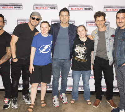 Leslie and her wife Bethany with New Kids on the Block