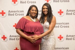 Sisters Danielle Warren (left) and Angela Jackson (right) standing together.