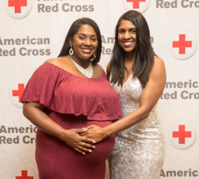 Sisters Danielle Warren (left) and Angela Jackson (right) standing together.