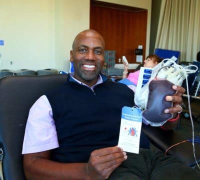 Dr. Mack holding his blood donation.