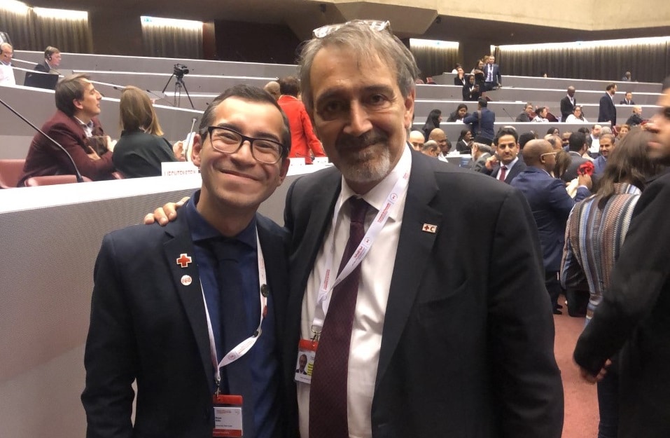 Bryan standing with IFRC President Francesco Rocca.